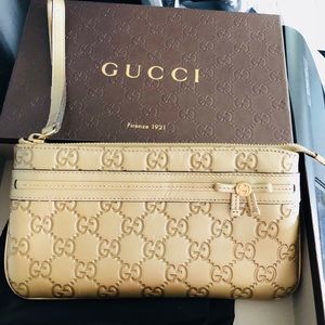 Golden Gucci wristlet